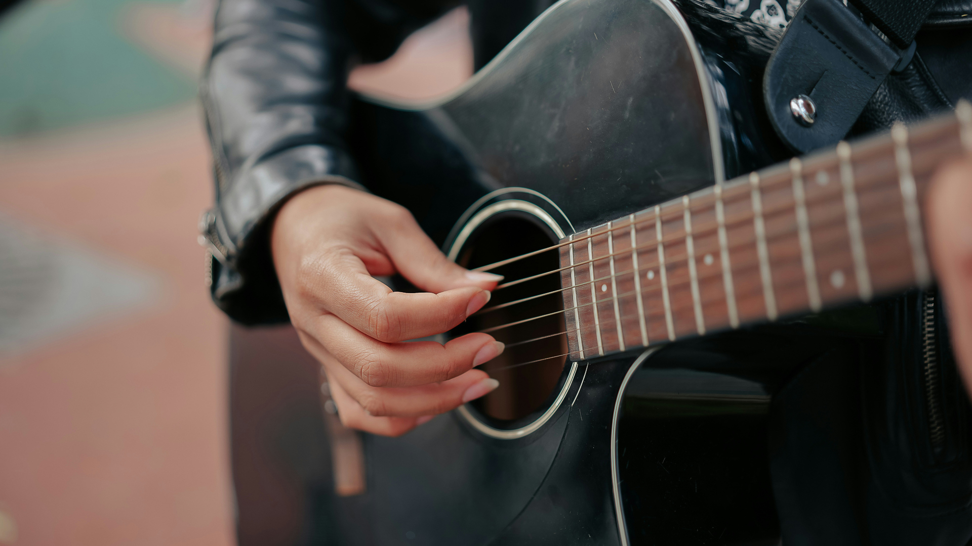 a person playing a guitar