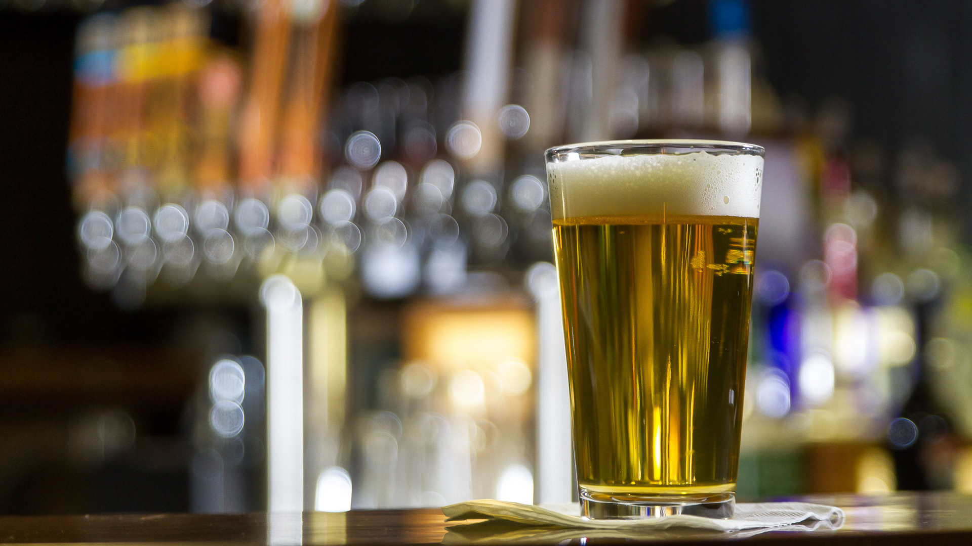 a glass of beer on a table