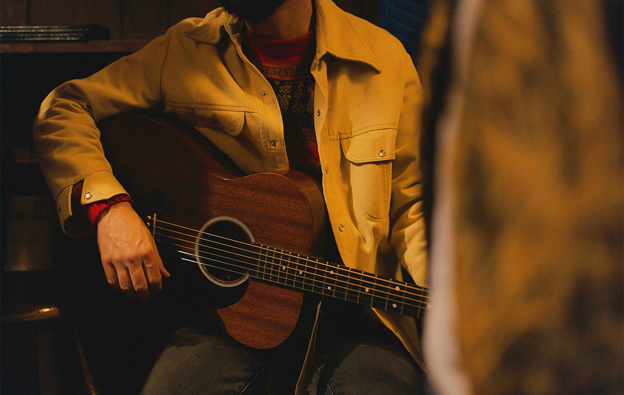 a person playing a guitar