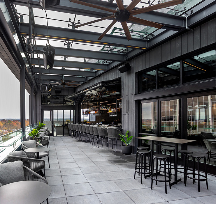 a patio with chairs and tables