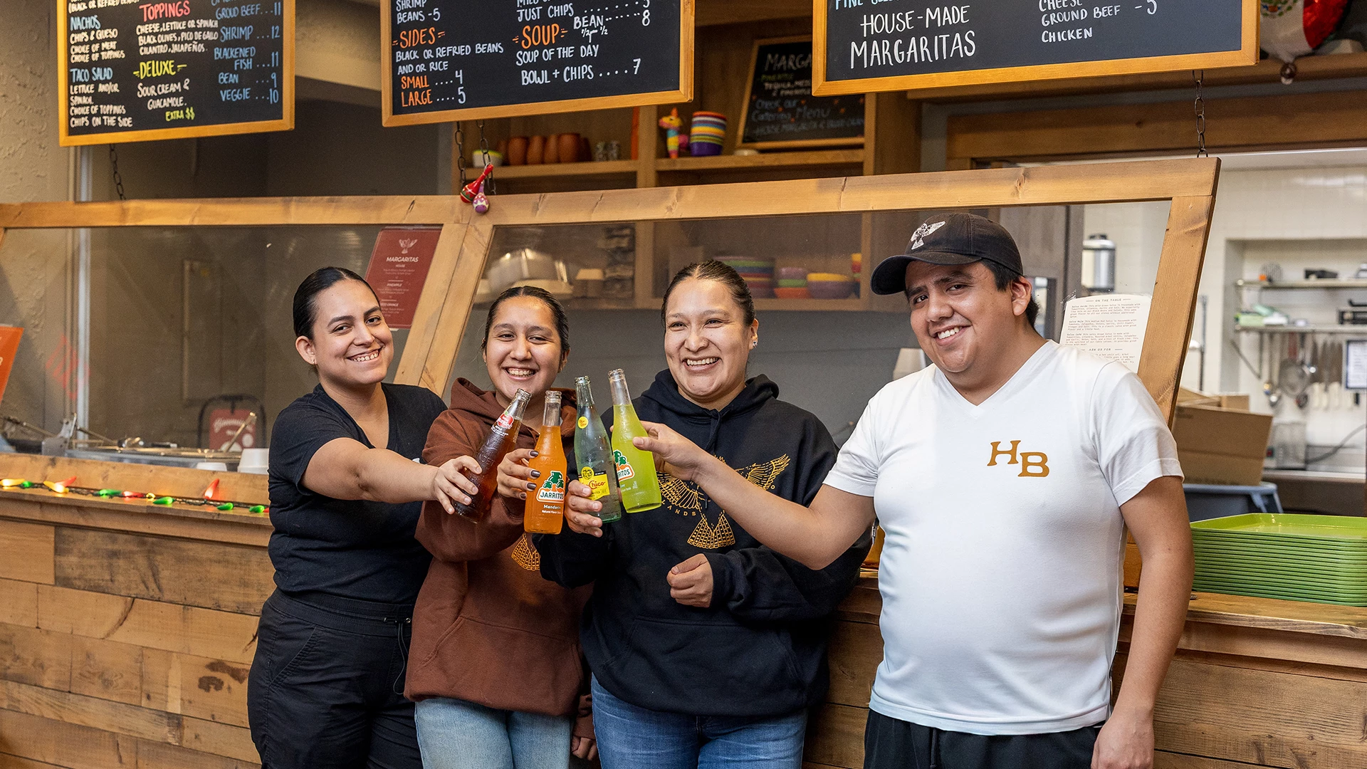 a group of people holding drinks