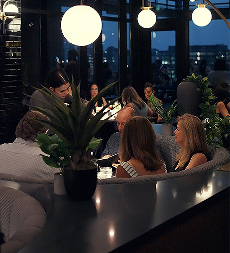 a group of people sitting in a round table