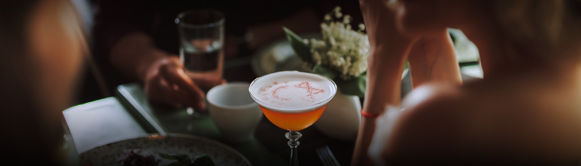 a glass with orange liquid in it