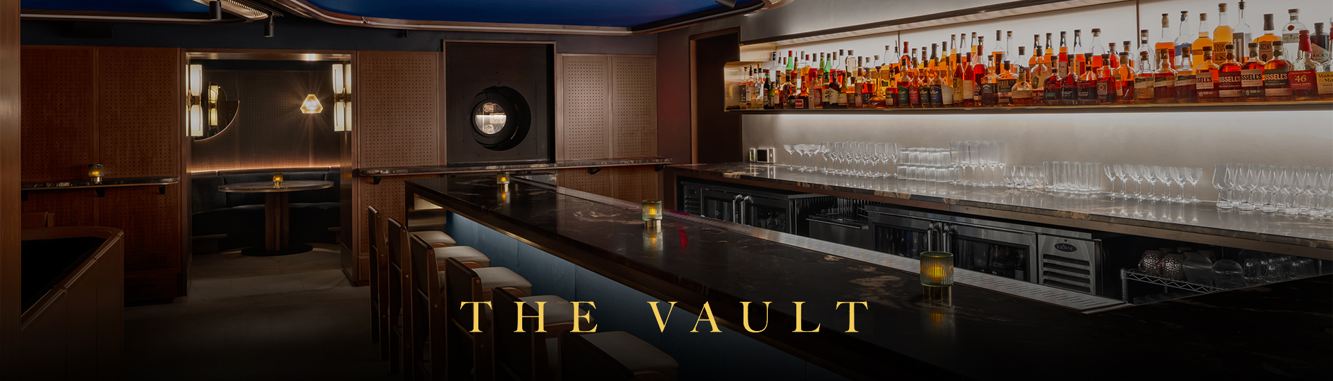 a bar with bottles of alcohol