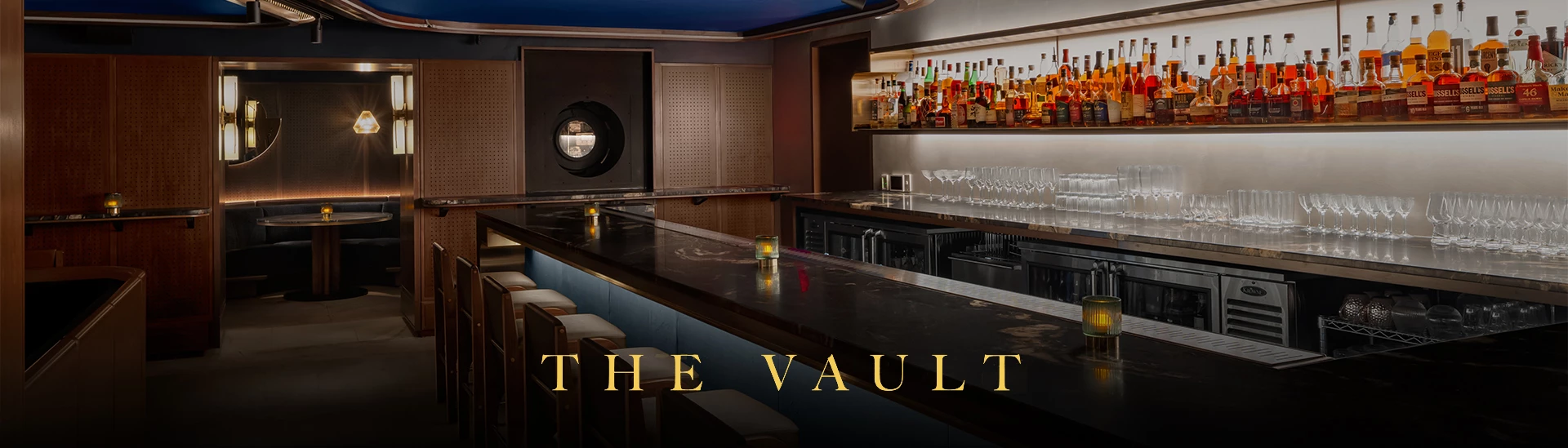 a bar with bottles of alcohol