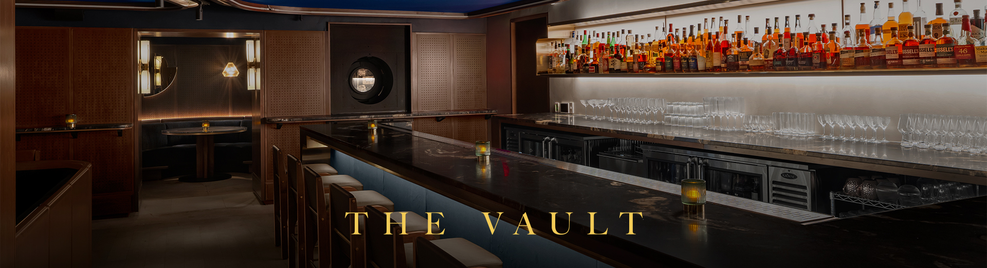 a bar with bottles of alcohol