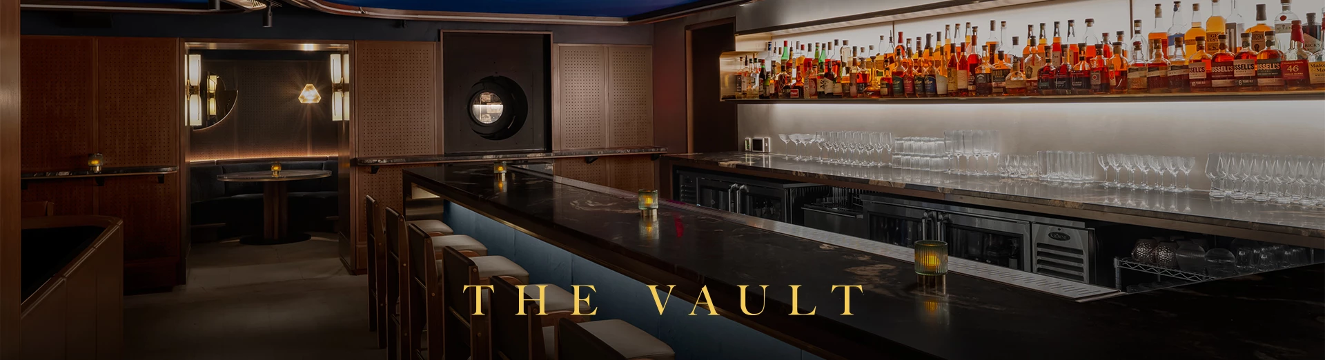 a bar with bottles of alcohol