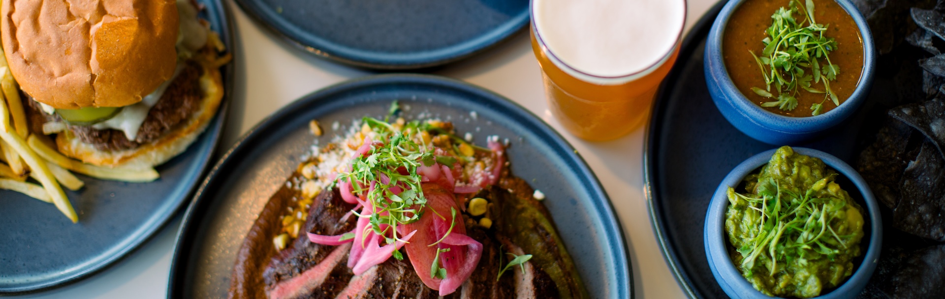 a plate of food and a glass of beer