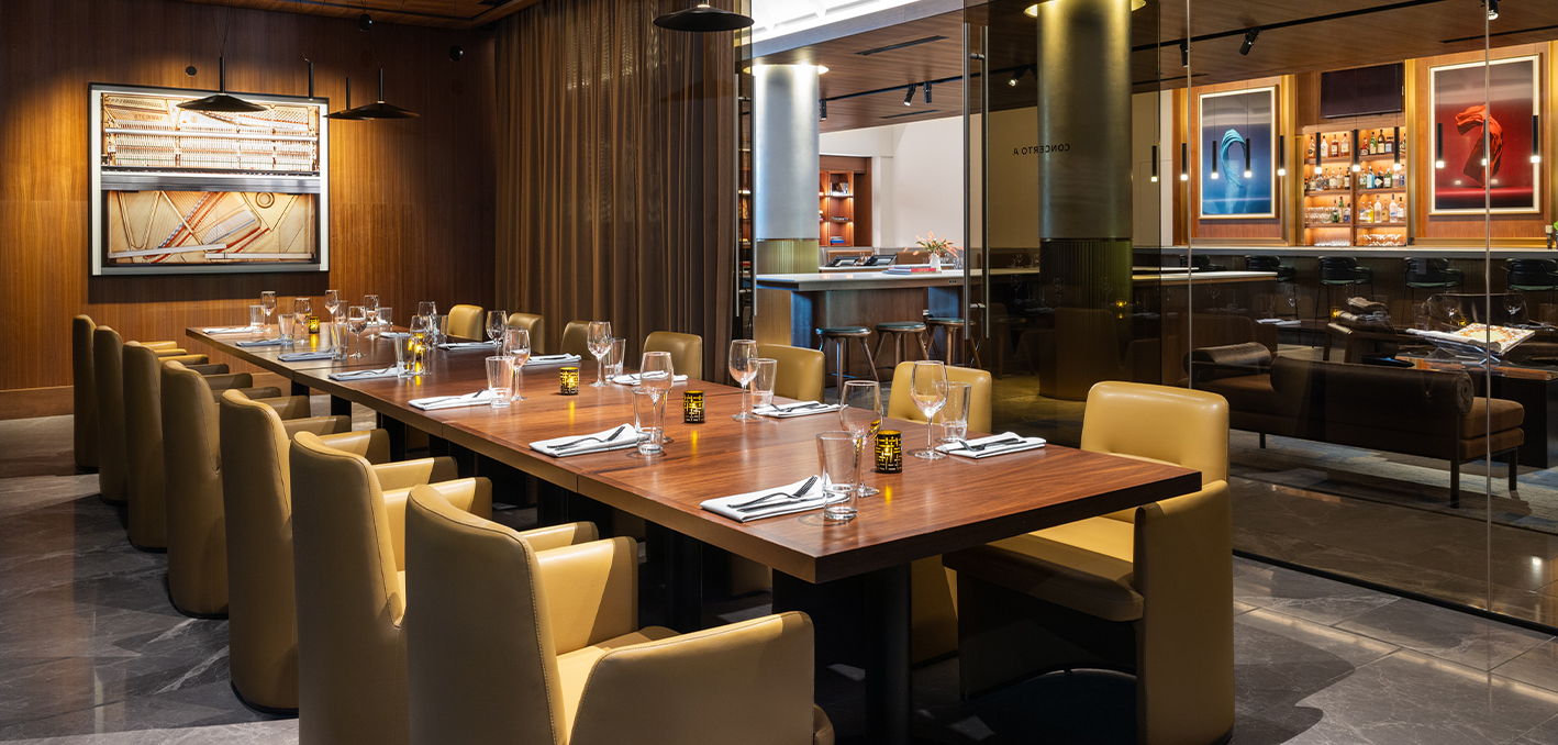 a table with glasses and napkins in a room with a curtain