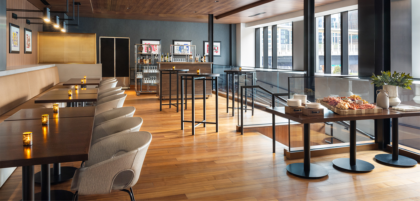 a room with a bar and chairs