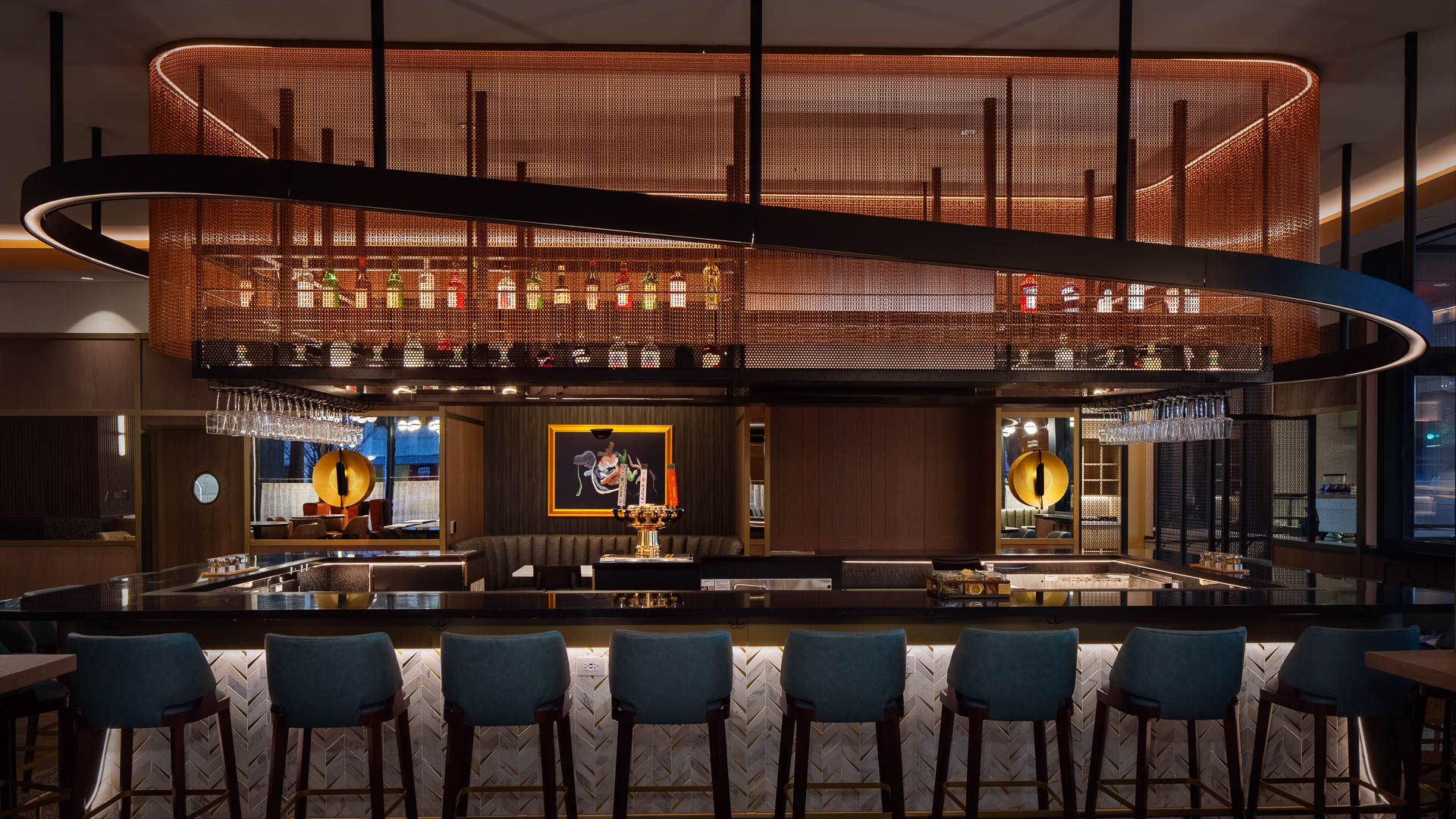 a bar with chairs and a picture on the wall