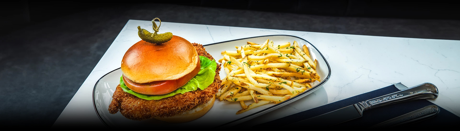 a burger and fries on a plate