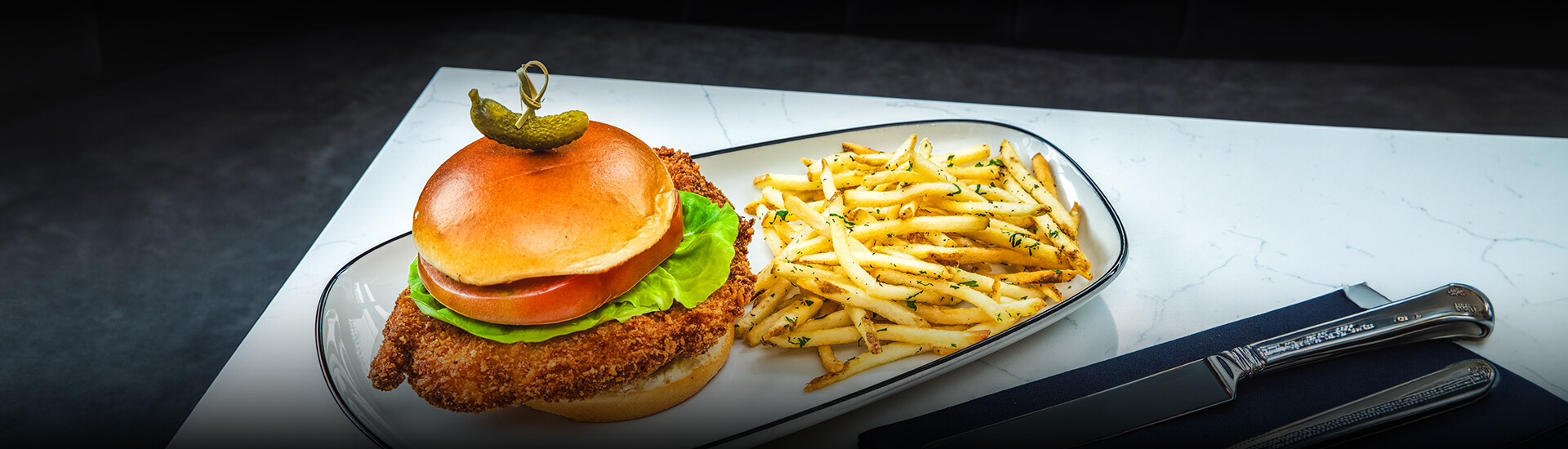 a burger and fries on a plate