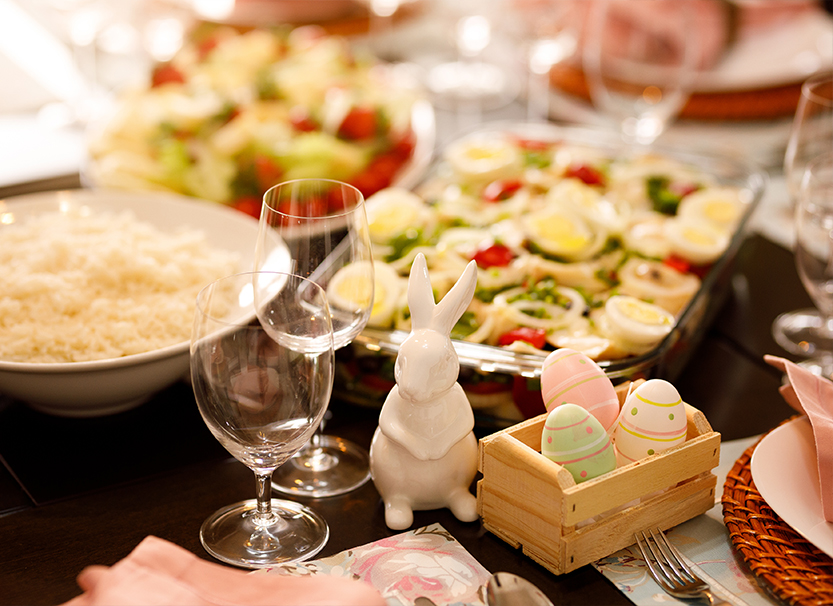a table with food and a bunny figurine