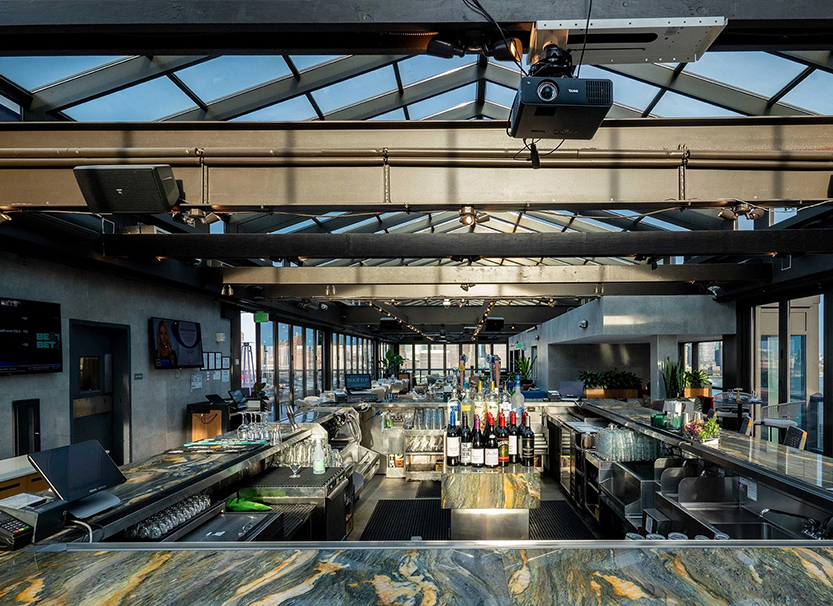a large room with a large counter and a large glass ceiling