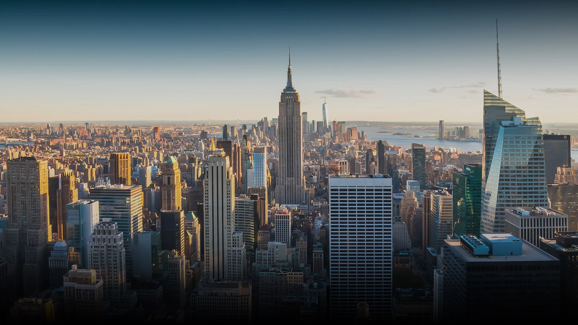 a city with tall buildings and a body of water