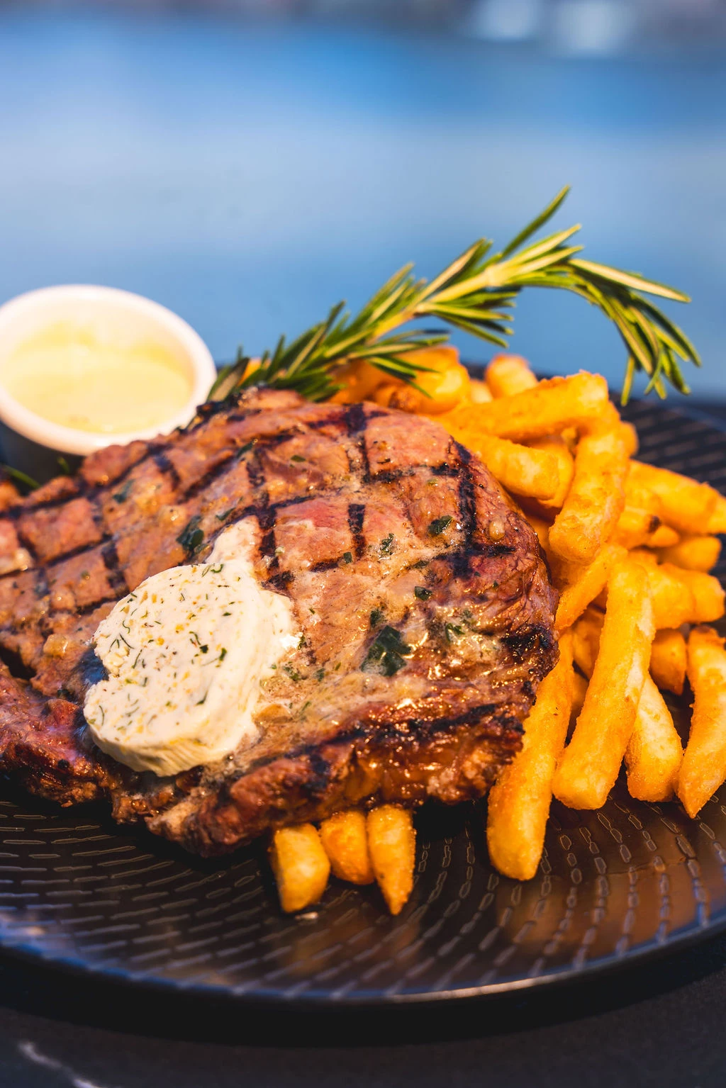 a plate of food with a sauce and fries