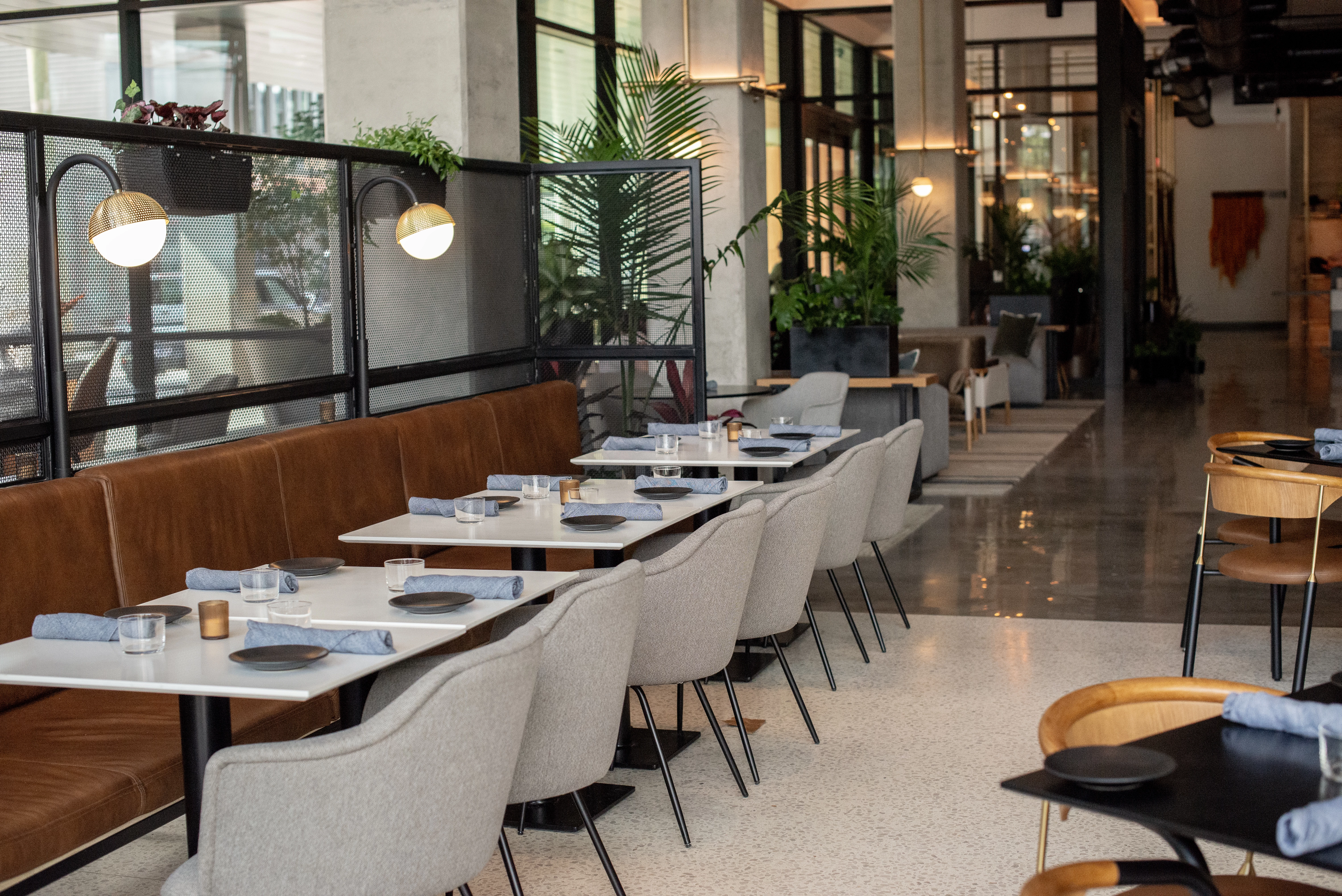 a long table with chairs and plates