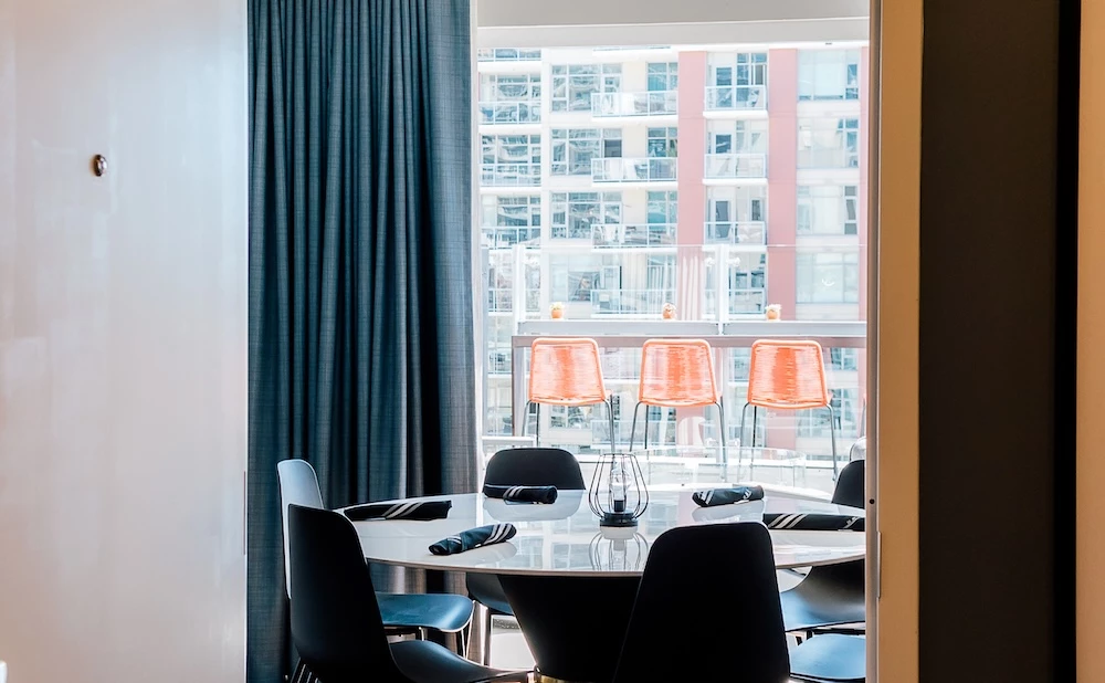 a room with a table and chairs