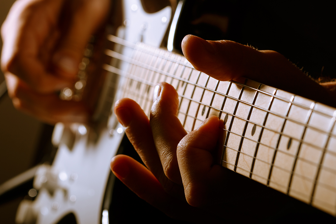 a person playing a guitar