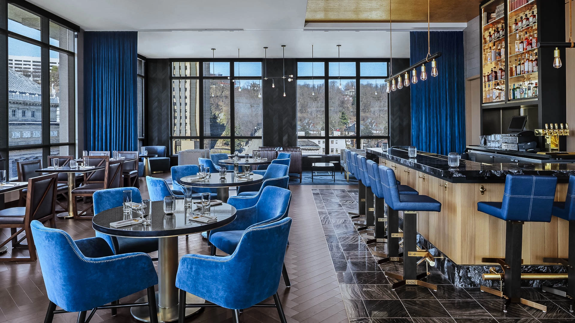 a room with blue chairs and tables