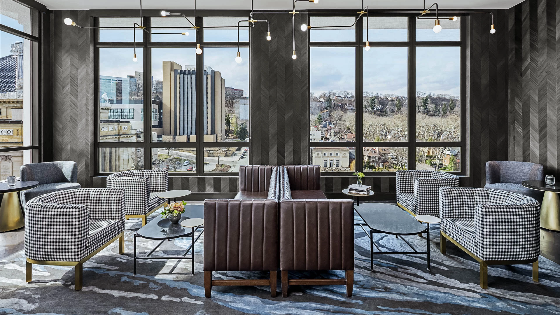a room with a couch and chairs