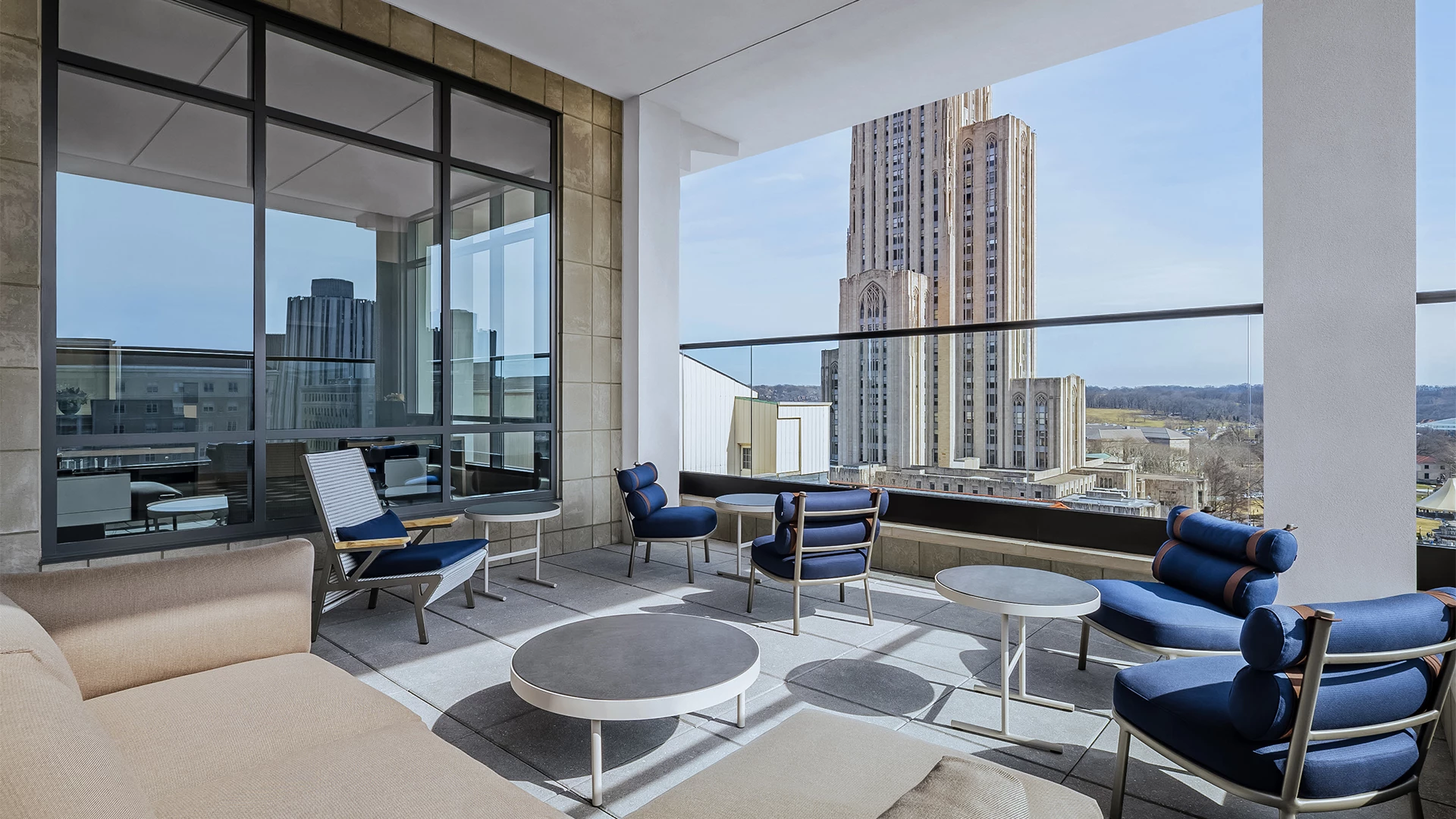 a patio with chairs and tables