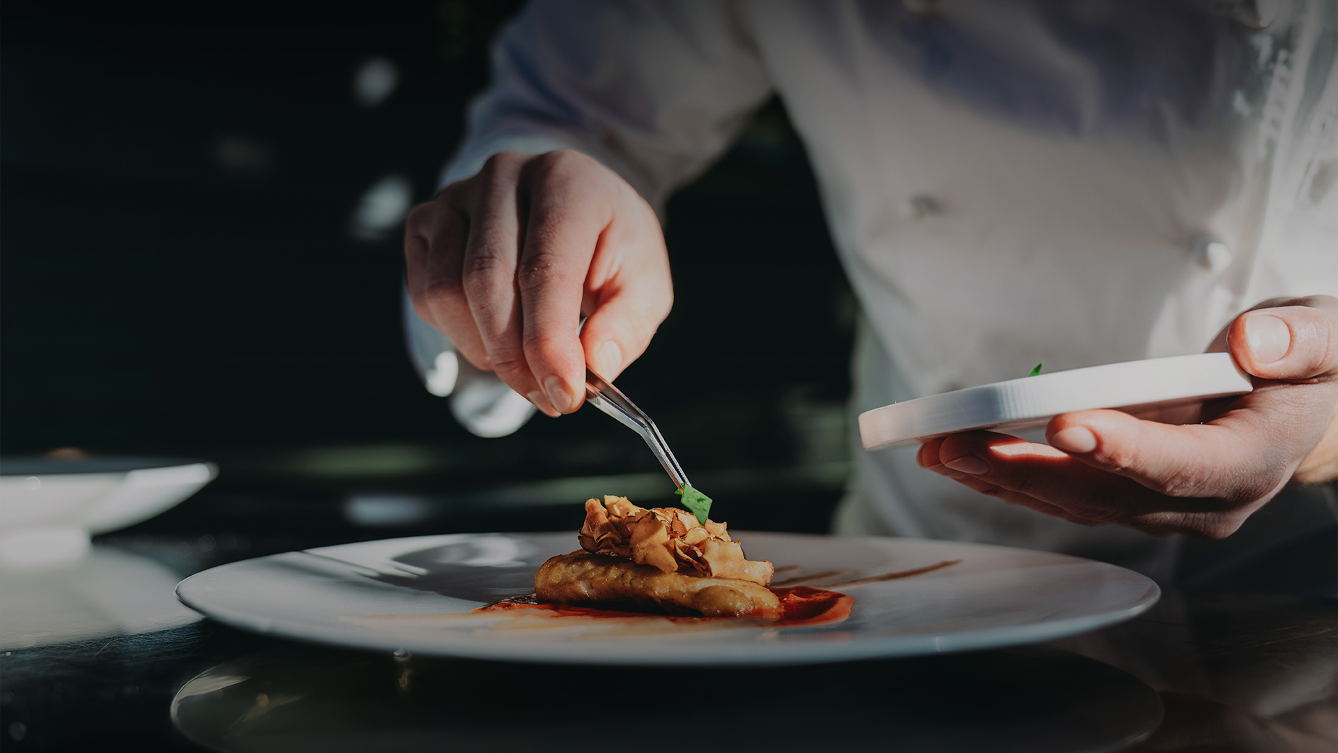 a person holding a plate of food