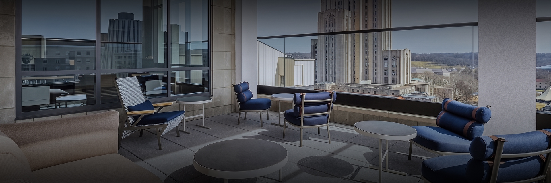 a patio area with chairs and tables