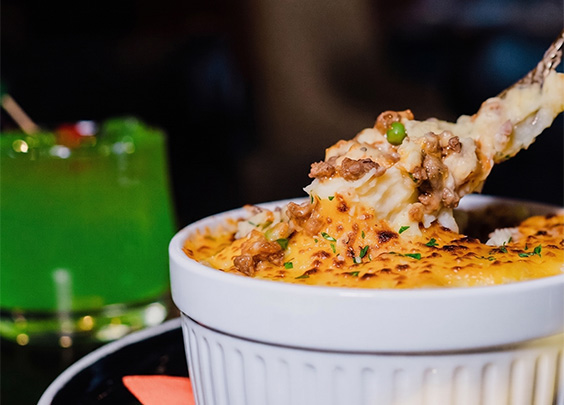 a bowl of food with a fork