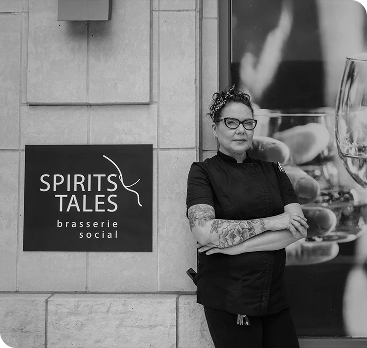 a woman standing in front of a sign