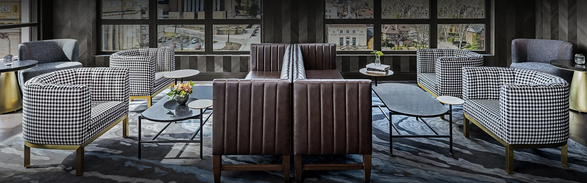 a room with a couch and chairs