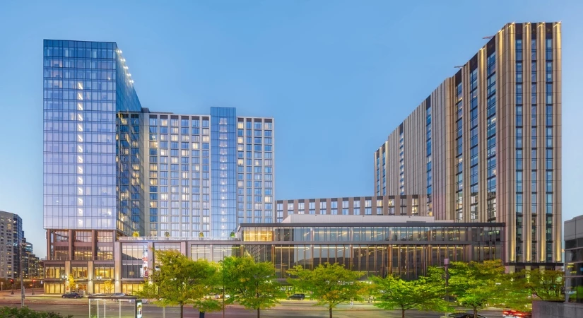 a group of buildings with trees in front of them