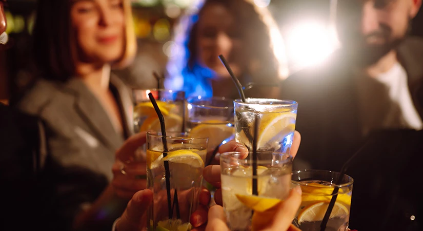 a group of people holding drinks
