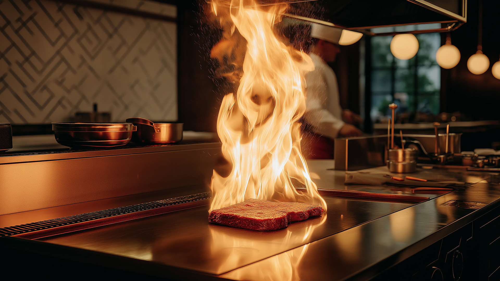 a steak on a grill with flames coming out of it