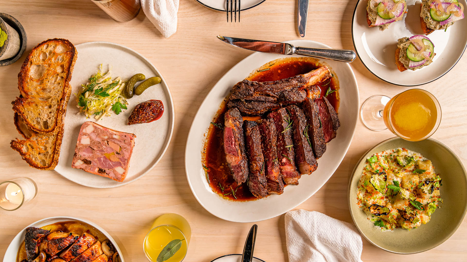 a plate of meat and food on a table