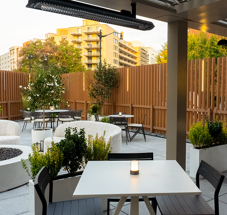 a patio with tables and chairs