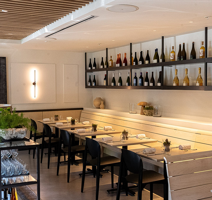 a restaurant with a long table and chairs