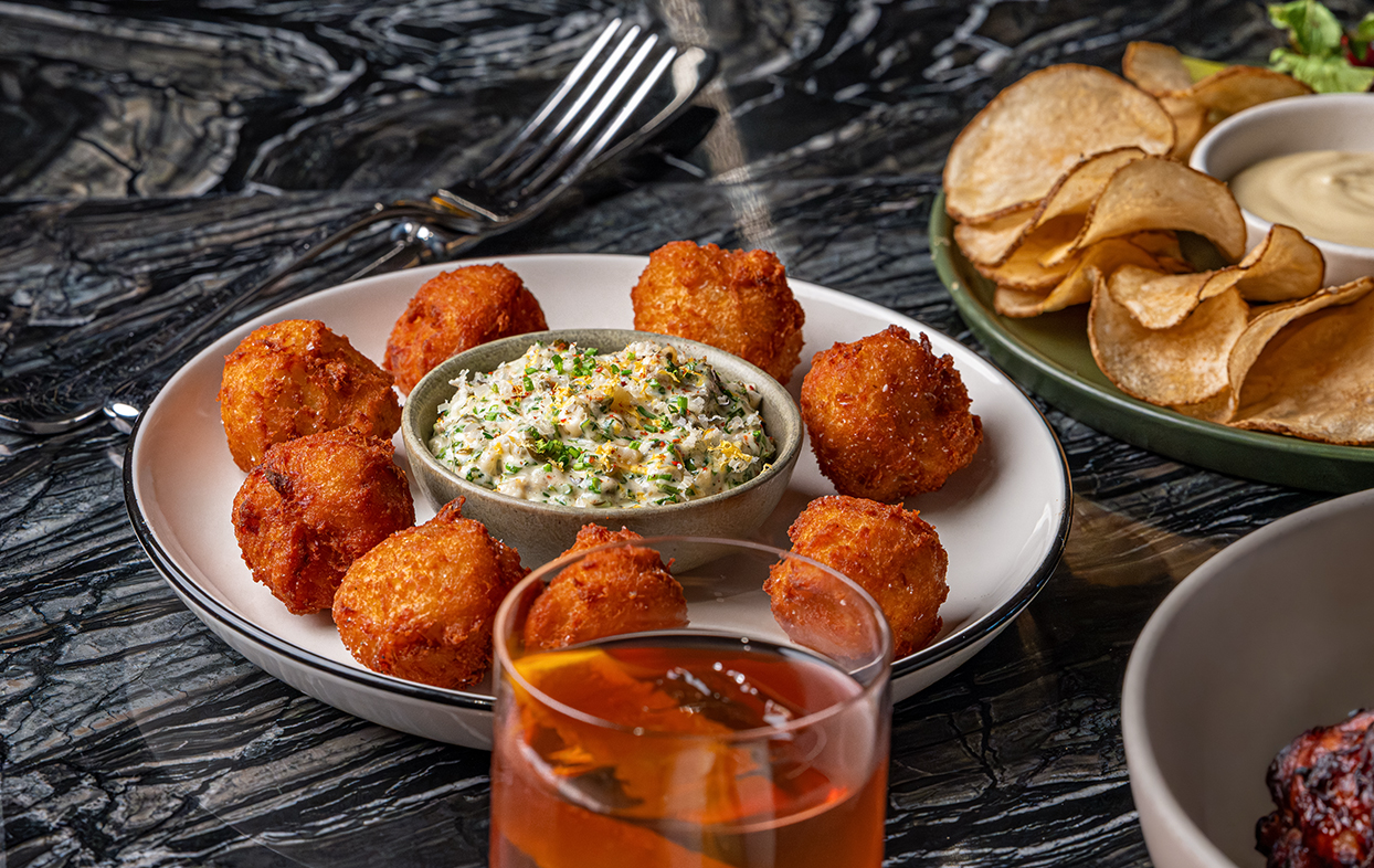 a plate of fried food and a drink