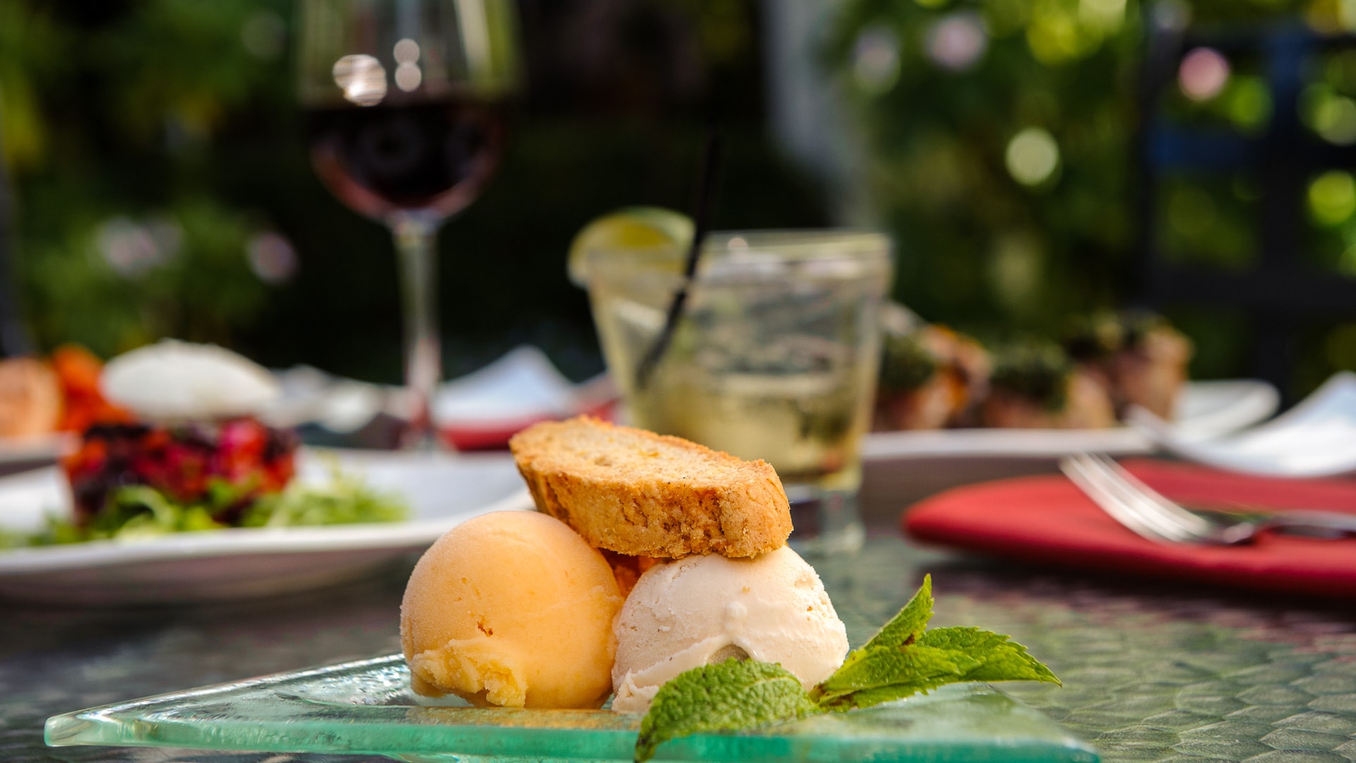 a plate of ice cream and a glass of wine