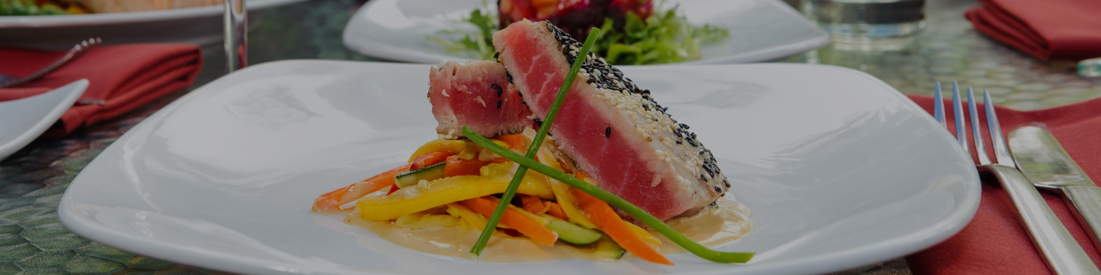a plate of food with a slice of tuna