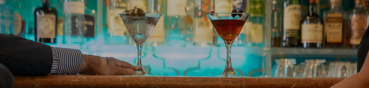 two glasses of liquid and a martini