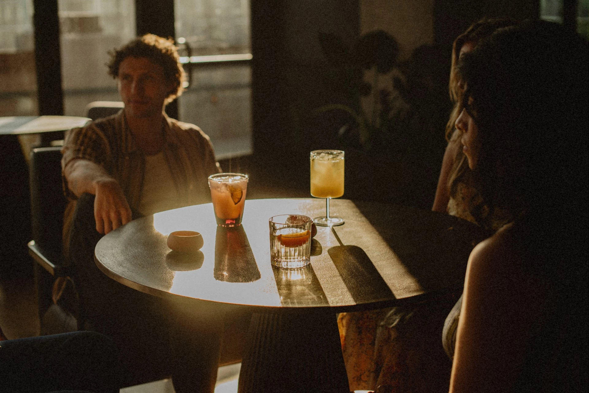 a group of people sitting at a table