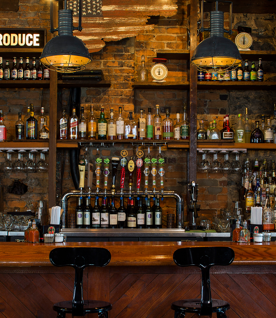 a bar with bottles of alcohol
