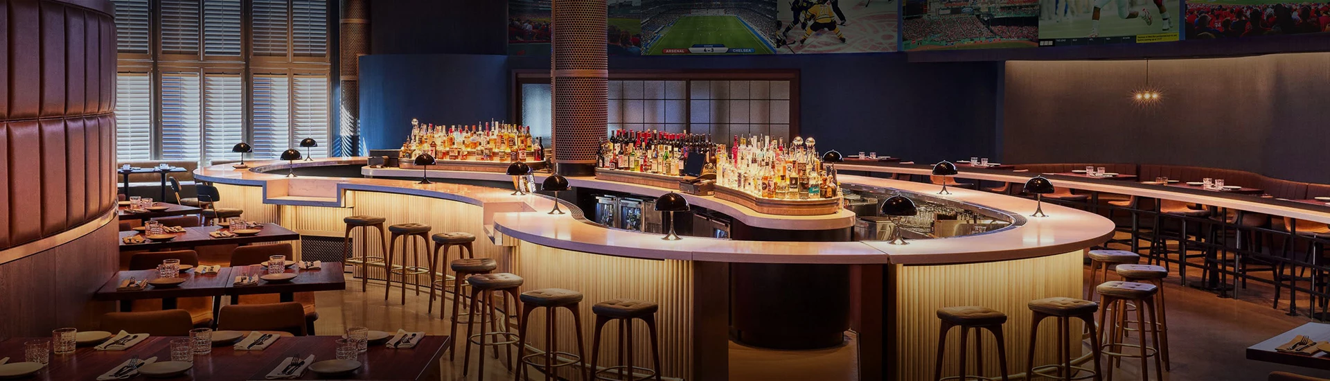 a bar with a row of bottles