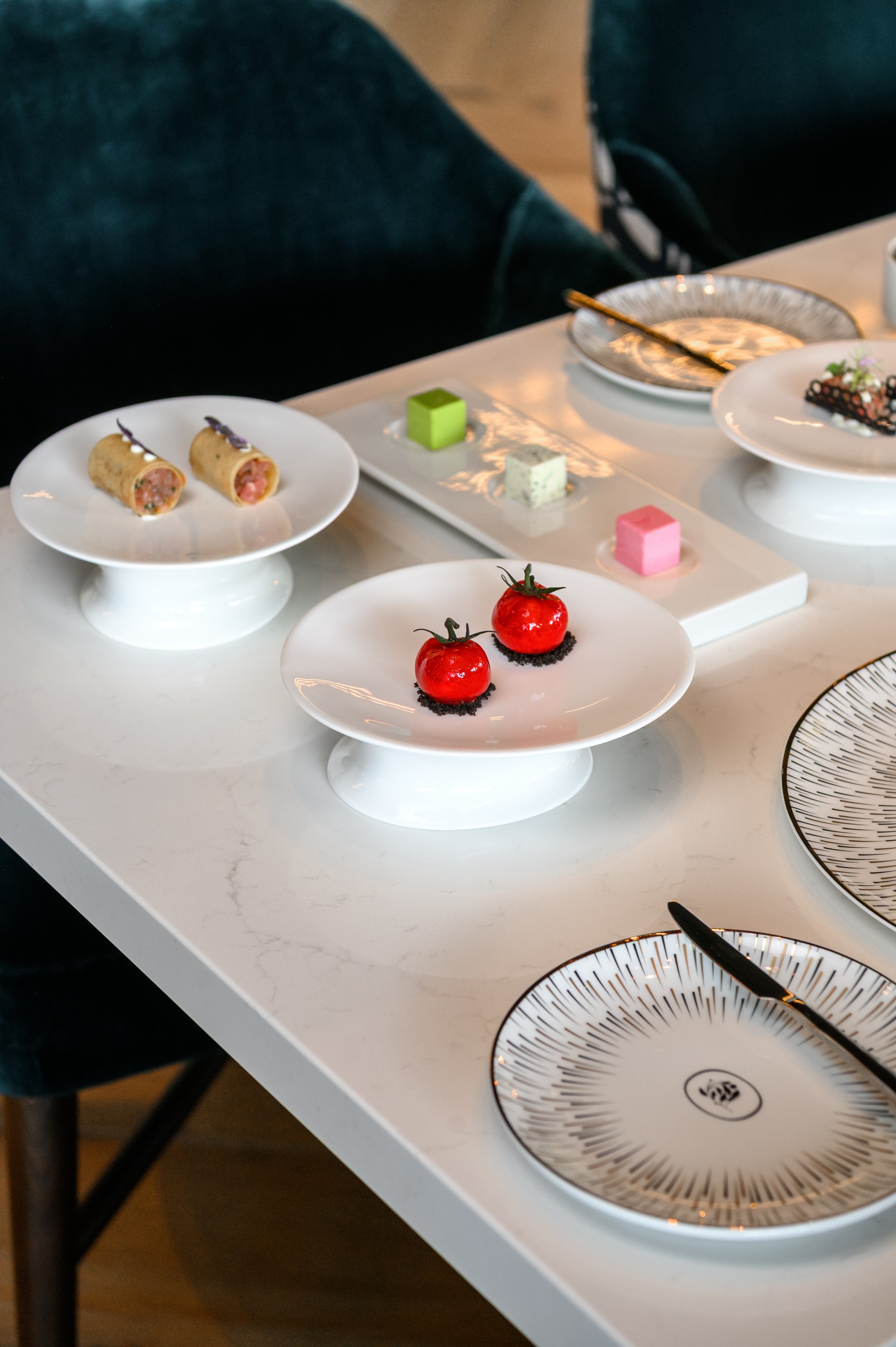 a table with plates and desserts