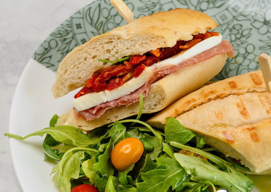 a sandwich with a salad on a plate