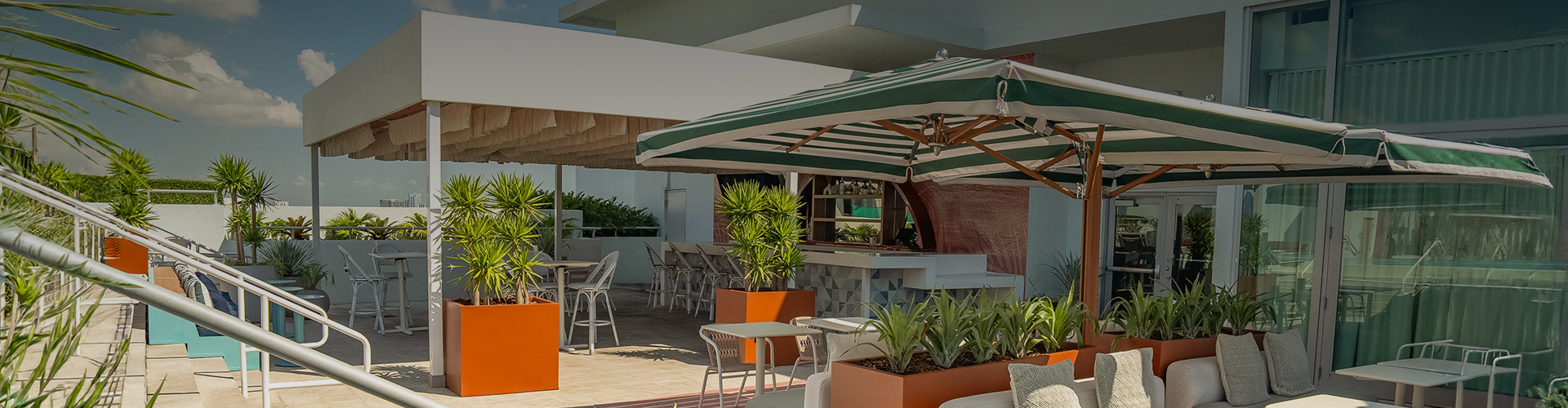 a patio with tables and chairs
