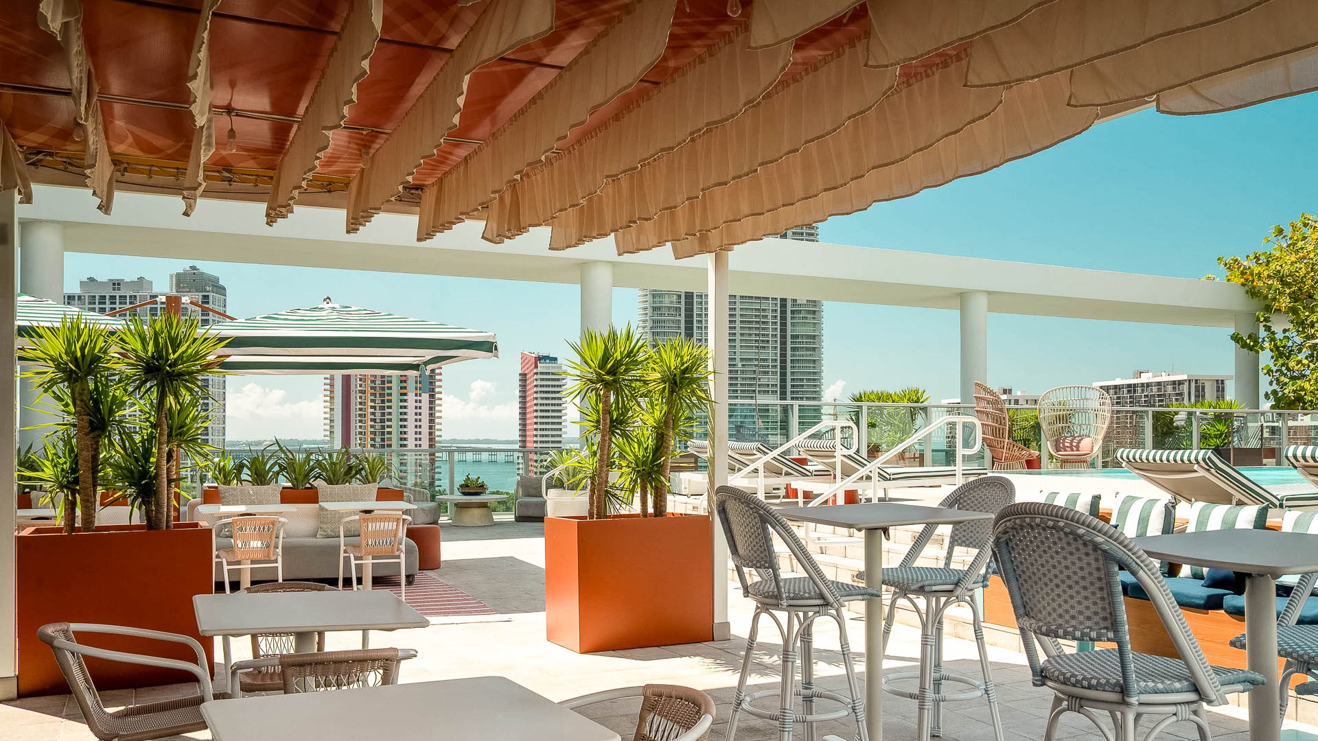 a patio with tables and chairs
