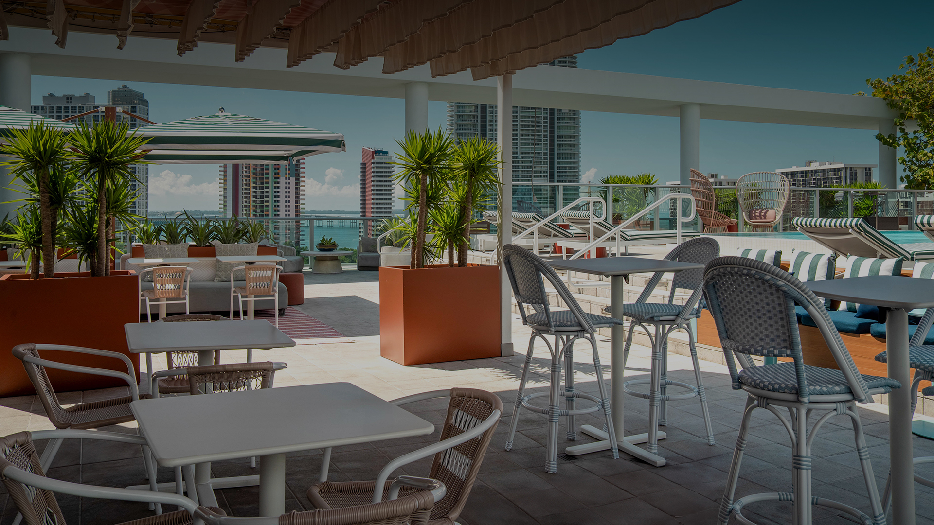 a patio with tables and chairs